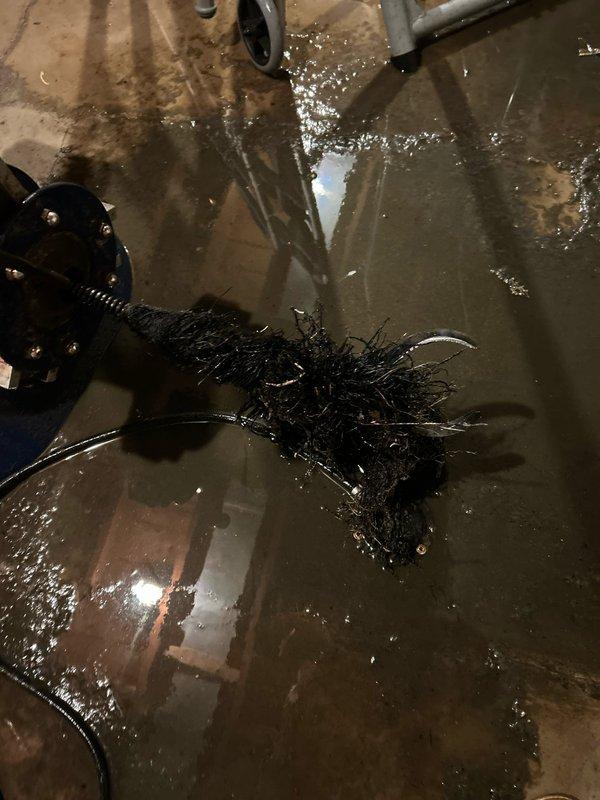 Performed inspection of floor drain system and conducted mechanical cleaning to remove accumulated debris and sediment. Drain brush was utilized to clear blockage, resulting in improved drainage. Scheduled follow-up appointment for installation of 5" cleanout cap.