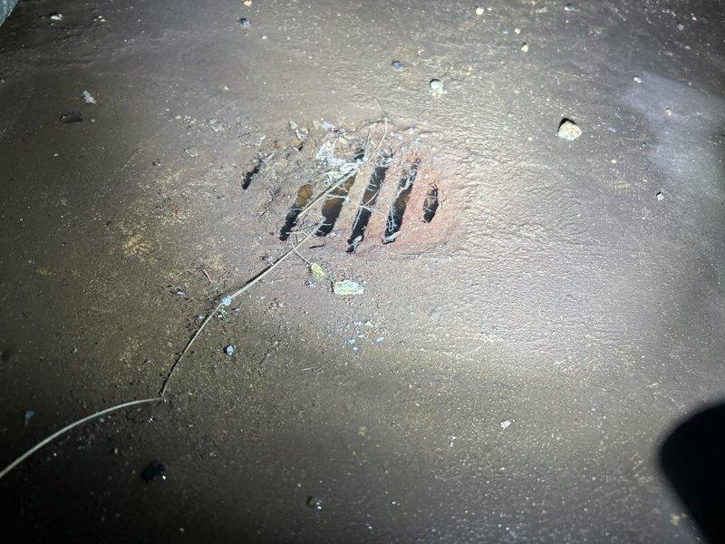 Inspected failed sump pump system in basement of century home, documenting extensive corrosion on metal pipes and drainage infrastructure. Determined pump (installed 2024) was still under warranty and initiated warranty claim process for replacement unit. Cleaned debris from drainage grate and advised homeowner on temporary water management solutions until replacement can be installed.