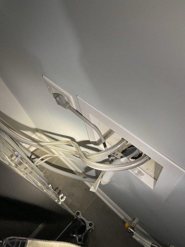 Installed and connected LG washer and dryer unit in customer's laundry area, including proper electrical hook-up to existing outlet and verification of water supply connections. Mounted units on pedestals and ensured all connections were secure with no leaks during testing cycle.