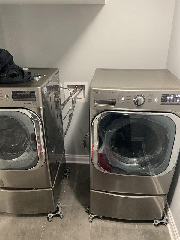 Installed and connected LG washer and dryer unit in customer's laundry area, including proper electrical hook-up to existing outlet and verification of water supply connections. Mounted units on pedestals and ensured all connections were secure with no leaks during testing cycle.