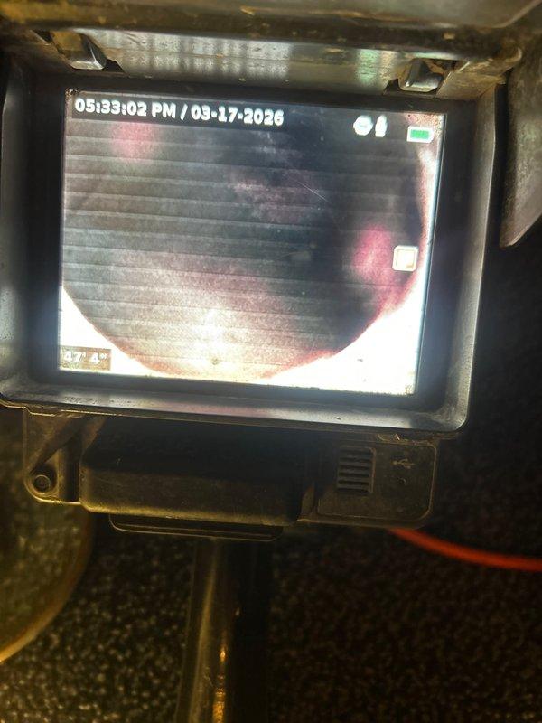 Performed disposal installation as scheduled. Conducted drain camera inspection which revealed root intrusion in the sewer line. Successfully removed root mass from the drain using drain snake/rodding equipment, restoring proper flow to the plumbing system.