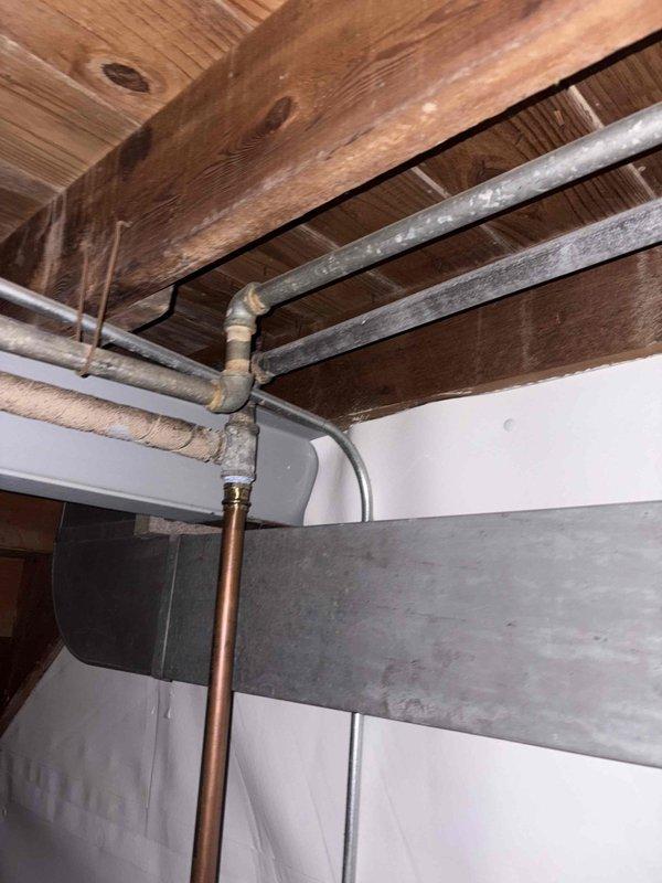 Conducted assessment of leaking 40-gallon gas water heater. Customer requested conversion to electric system. Inspected electrical panel capacity and examined existing plumbing infrastructure to evaluate feasibility of conversion. Documented current installation conditions and provided estimate for removal of gas unit, installation of customer-selected electric water heater, and necessary electrical and plumbing modifications.