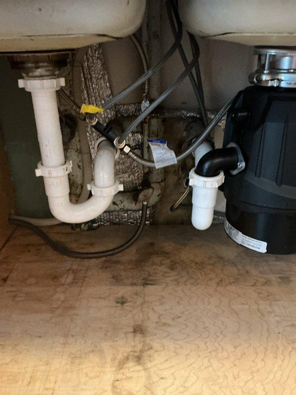Serviced tanked water heater per request, including complete drain and cleaning. Inspected and repaired non-functioning recirculation pump that was preventing proper water flow to kitchen. System now operating normally with restored hot water circulation throughout the home.