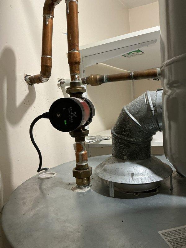 Serviced tanked water heater per request, including complete drain and cleaning. Inspected and repaired non-functioning recirculation pump that was preventing proper water flow to kitchen. System now operating normally with restored hot water circulation throughout the home.