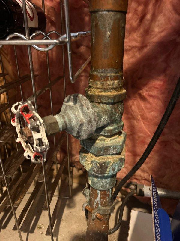 Repaired faulty gate valves located in insulated wall cavity. Replaced worn components on both the red/white control wheel valve and brass finish valve, restoring proper functionality and eliminating spinning issue. System now operates correctly with no leaks observed at connections.