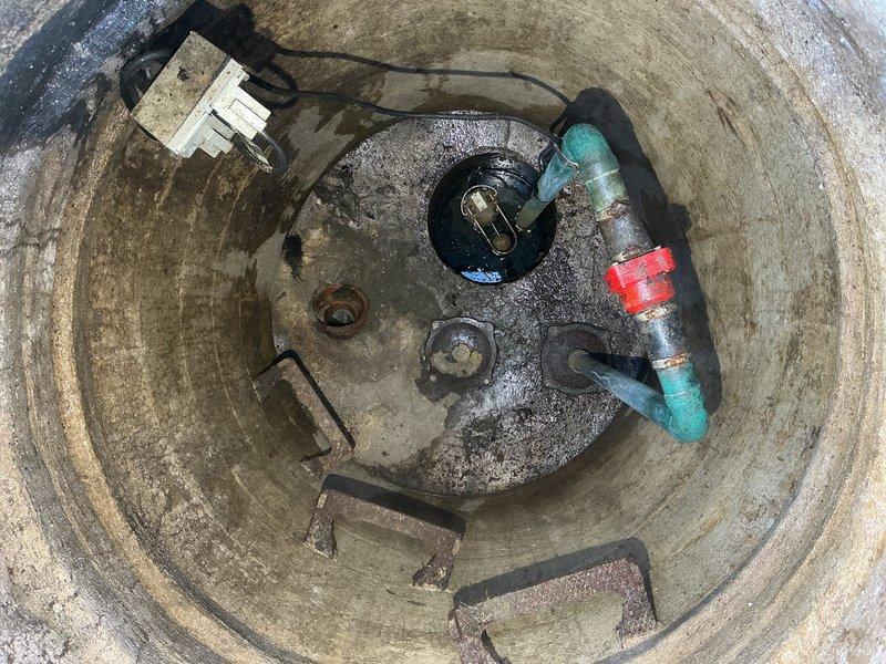 Conducted inspection of collapsed sewer line extending approximately 15 feet under the residence. Documented evidence of water intrusion affecting interior flooring and walls, with visible moisture damage. Inspection of utility access pit revealed compromised concrete infrastructure with significant water exposure around the existing PVC pipe system, requiring complete line replacement.
