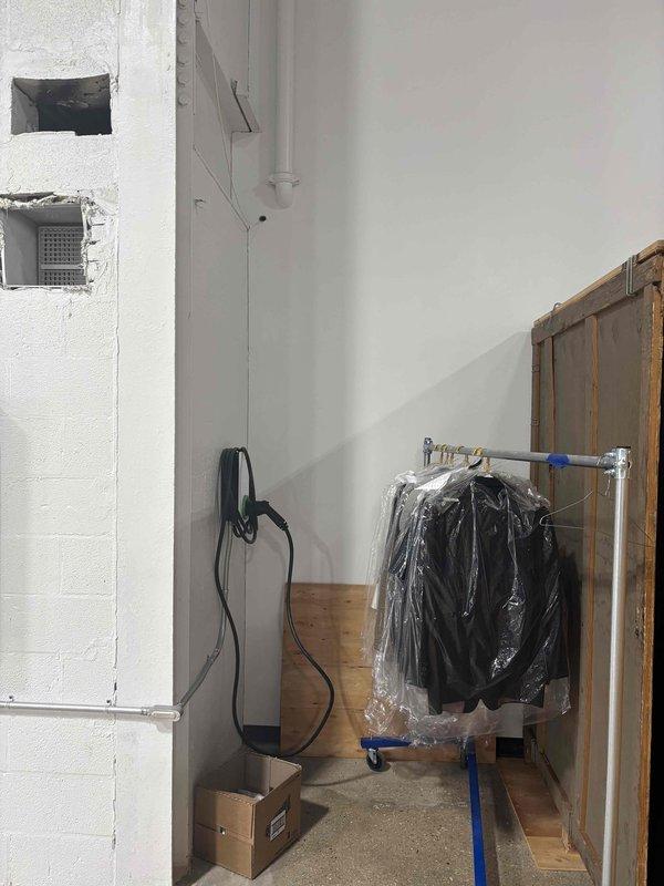Conducted a site assessment for relocating an existing 40-50 gallon water heater. Evaluated current installation in utility area with limited space constraints, noting existing connections to copper supply lines with shutoff valve. Documented potential new location considering proper clearances, venting requirements, and accessibility for future service.