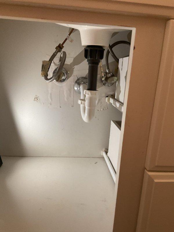Responded to service call for a leaking pipe under sink in 20-year-old home, where issue had been ongoing for approximately one week. Upon inspection, identified deteriorated P-trap connection as source of leak. Replaced damaged section of PVC drainage assembly, installed new P-trap with proper seals, and verified all connections were secure. Tested repair by running water through system for 3 minutes with no leaks observed.