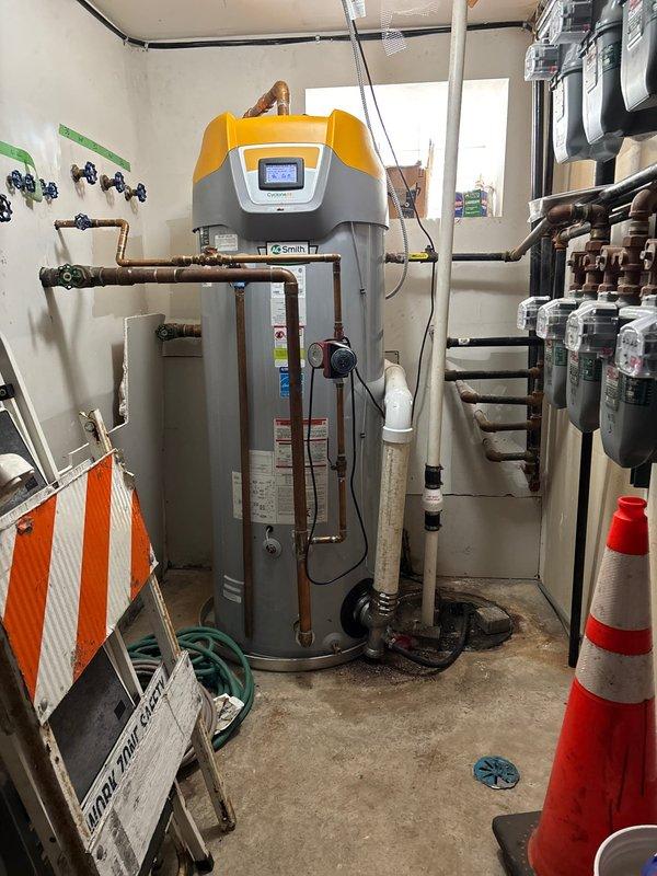 Completed water heater replacement in utility room, installing new A.O. Smith unit with proper connections to existing copper piping. Verified gas line integrity with appropriate shutoff valve tagging and ensured proper venting of the system according to manufacturer specifications.
