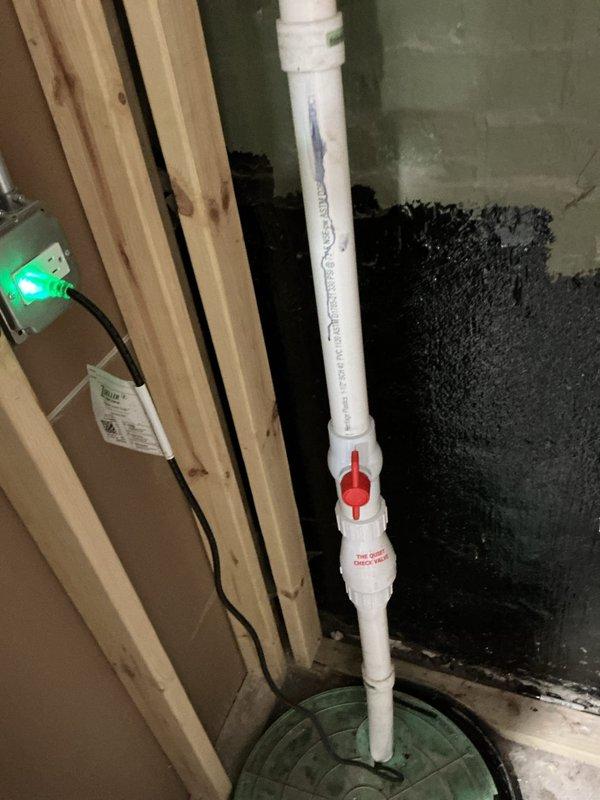 Completed priority camera inspection of plumbing system as rescheduled. Documented key infrastructure components including copper supply lines with caution-tagged valves and a PVC drain line with red control valve. Inspection revealed system appears functional with normal wear, with special attention paid to tagged connection points.