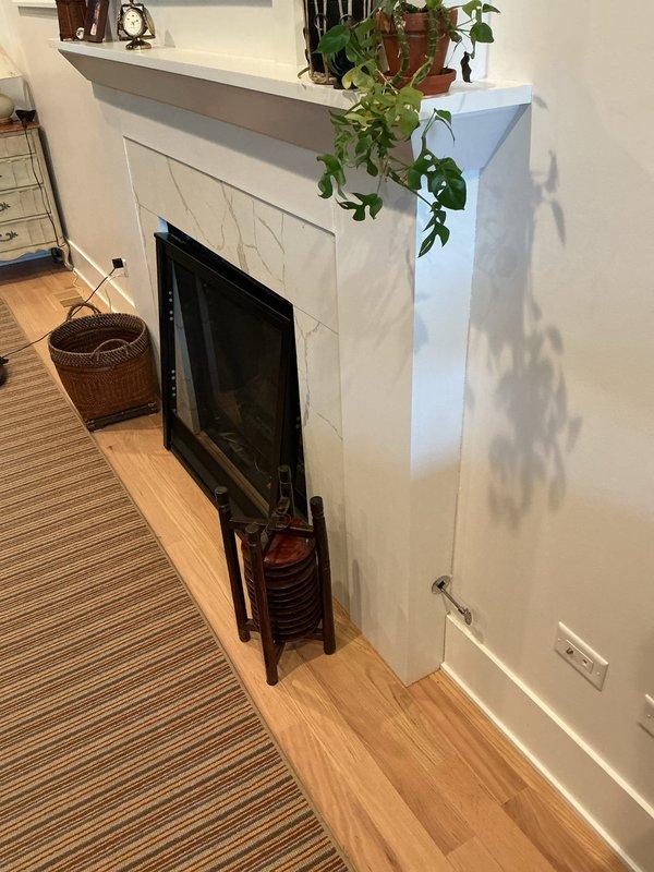 Performed gas leak investigation and pressure test on residential system after emergency call. Discovered significant corrosion and deterioration on copper gas supply line with visible oxidation and mineral deposits near fireplace installation. Provided customer with assessment and estimate for complete home gas line repiping to address safety concerns.