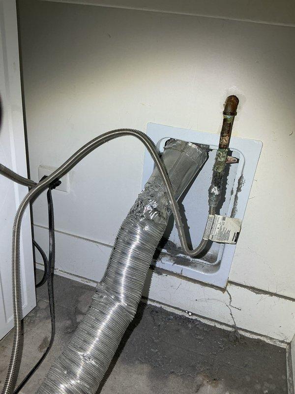 Performed gas leak investigation and pressure test on residential system after emergency call. Discovered significant corrosion and deterioration on copper gas supply line with visible oxidation and mineral deposits near fireplace installation. Provided customer with assessment and estimate for complete home gas line repiping to address safety concerns.