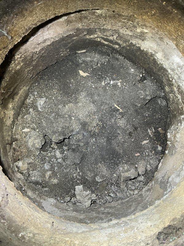 Conducted inspection of utility sink installation and assessed deteriorated drainage pipe. Installed new utility sink with standard two-handle chrome fixture. Documented extensive pipe degradation showing multiple cracks, fragmentation, and sediment buildup. Recommended options for addressing intermittent burping noise in kitchen sink that occurs after heavy rainfall when sump pump operates frequently.