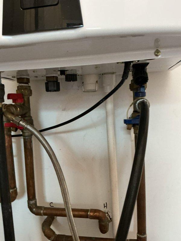 Completed routine maintenance flush on tankless water heater system to remove mineral buildup and ensure optimal performance. Inspected all copper piping connections, verified proper function of isolation valves (both hot and cold sides), and checked for any signs of leakage or corrosion. System was successfully returned to service with proper flow rates restored.