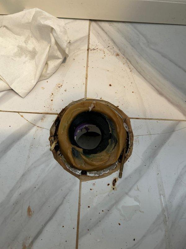 Removed and disposed of existing toilet fixture. Replaced deteriorated wax ring and cleaned corroded toilet flange. Successfully installed customer-supplied Kohler 1.28 GPF toilet, ensuring proper seal at the base and secure mounting of all components including seat assembly.