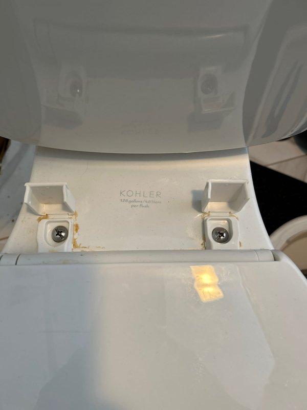 Removed and disposed of existing toilet fixture. Replaced deteriorated wax ring and cleaned corroded toilet flange. Successfully installed customer-supplied Kohler 1.28 GPF toilet, ensuring proper seal at the base and secure mounting of all components including seat assembly.