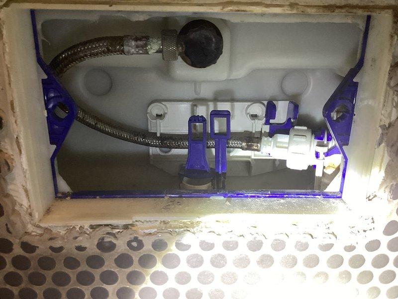 # Service Report: In-Wall Toilet System Repair

Responded to service call for Duravit in-wall toilet system requiring maintenance. Upon arrival, accessed the concealed cistern by removing the actuator plate to expose the internal flush mechanism. Inspected the flush valve assembly, inlet valve, and dual-flush actuator system mounted within the wall cavity. The blue plastic mounting frame and braided stainless steel supply lines were examined for proper installation and function. Verified all connections, seals, and the flapper mechanism were operating correctly. Checked the wall-mounted valve cartridges and trim assembly for proper alignment and secure mounting. Serviced the internal components, ensuring the flush system operates efficiently and all concealed plumbing connections are leak-free. Reinstalled access panel and tested full system operation to confirm proper flushing performance.