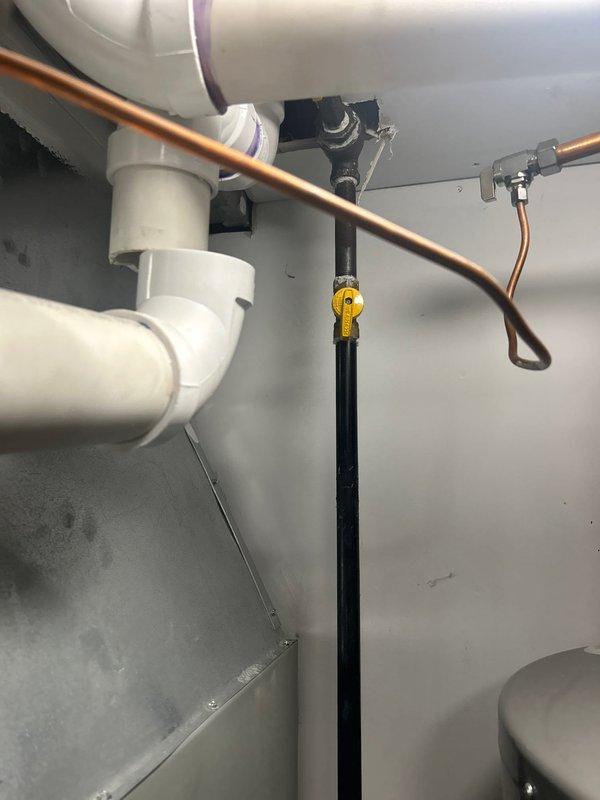 Responded to customer request for leaking water heater evaluation. Upon arrival, inspected 10-year-old 50-gallon power vent water heater with active leak originating from tank base. Documented existing plumbing configuration including copper supply lines, PVC venting system, pressure relief valve assembly, and all associated connections. Photographed installation setup and leak source for estimate preparation. Provided comprehensive assessment and replacement recommendations for failed water heater unit.