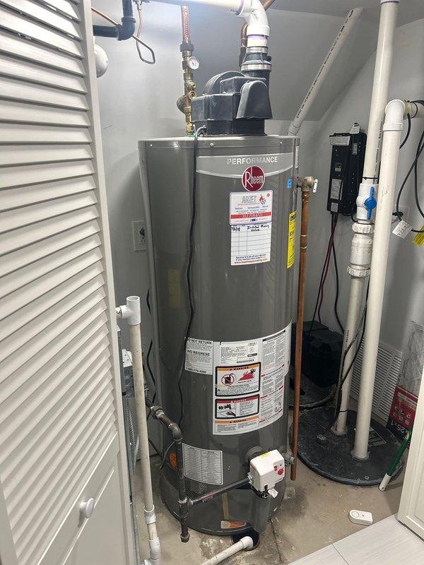 Responded to customer request for leaking water heater evaluation. Upon arrival, inspected 10-year-old 50-gallon power vent water heater with active leak originating from tank base. Documented existing plumbing configuration including copper supply lines, PVC venting system, pressure relief valve assembly, and all associated connections. Photographed installation setup and leak source for estimate preparation. Provided comprehensive assessment and replacement recommendations for failed water heater unit.