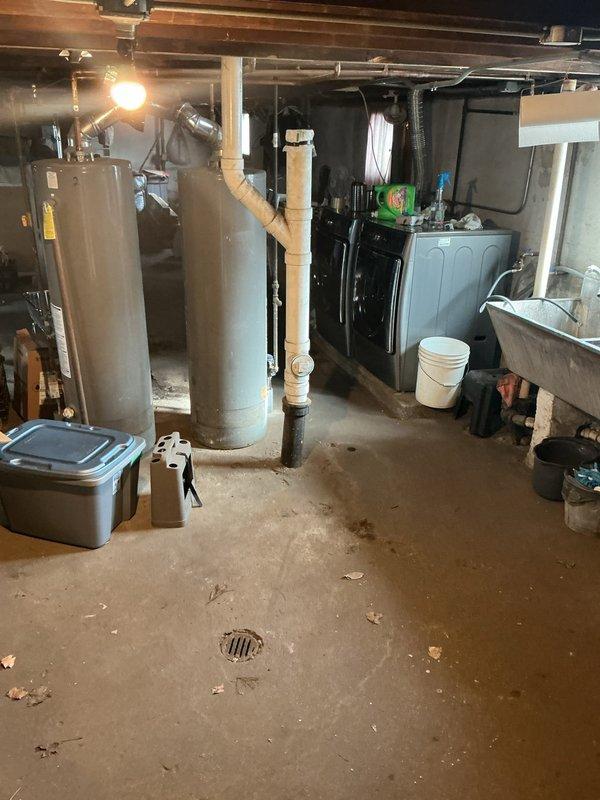 Conducted on-site consultation for residential property undergoing extensive renovations including basement floor drain reconstruction and first-floor complete rehabilitation of kitchen, full bathroom, half bathroom, and basement laundry room. Assessed existing basement utility area with floor drain, water heaters, furnace, and plumbing infrastructure to determine scope of work. Provided detailed information and recommendations regarding exterior drain tile system installation and catch basin placement options to address drainage requirements for the renovated spaces.