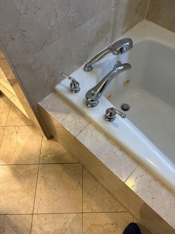 Responded to service call for pipe leak in ceiling above bathroom area. Upon inspection, located source of water leak affecting ceiling structure. Accessed plumbing lines running through ceiling cavity above jetted bathtub installation. Identified compromised pipe connection causing water seepage into ceiling materials. Performed necessary repairs to leaking pipe, tested water pressure and flow to verify integrity of repair. Confirmed no additional moisture intrusion and ensured all plumbing connections were properly sealed and functioning correctly.