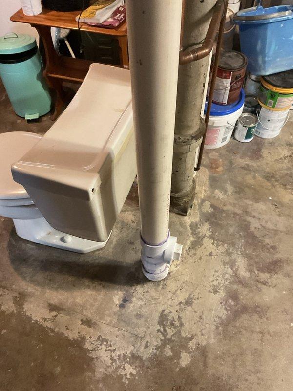 Responded to service call for multiple plumbing issues including a basement toilet that was not flushing properly and gurgling when upstairs toilet was flushed, indicating a potential venting or drainage obstruction. Inspected and diagnosed the toilet drainage system and venting configuration. Additionally assessed a first floor bathroom shower mixer valve that was making noise when in the off position, which stopped when adjusted, suggesting internal valve component wear or water hammer issues. Evaluated the first floor kitchen plumbing system, which included a garbage disposal, dishwasher, and dual sink configuration. Upon inspection, identified that the existing disposal installation and drain connections did not meet current plumbing code requirements. Documented the under-sink plumbing assembly showing non-compliant configuration with improper venting and drainage connections. Provided estimate for garbage disposal replacement with proper code-compliant installation including appr