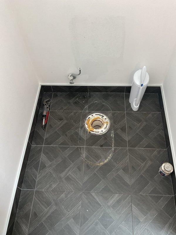 Responded to a main bathroom drainage issue where the second-floor toilet was backing up into the shower. Upon arrival, found the toilet flushing properly but the shower drain completely blocked and not draining. Utilized drain cleaning equipment to clear the obstruction in the main drain line that was causing the backup between fixtures. Removed and inspected the shower drain assembly to ensure proper flow and verified that the blockage was cleared from the shared drainage system. Tested both the toilet and shower to confirm proper drainage and that no further backup was occurring between the fixtures.