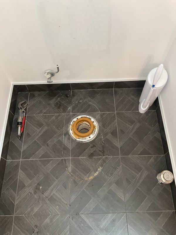 Responded to a main bathroom drainage issue where the second-floor toilet was backing up into the shower. Upon arrival, found the toilet flushing properly but the shower drain completely blocked and not draining. Utilized drain cleaning equipment to clear the obstruction in the main drain line that was causing the backup between fixtures. Removed and inspected the shower drain assembly to ensure proper flow and verified that the blockage was cleared from the shared drainage system. Tested both the toilet and shower to confirm proper drainage and that no further backup was occurring between the fixtures.