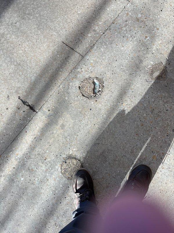 Responded to recurring main line backup issue under warranty coverage. Upon arrival, located and accessed the main sewer cleanout in exterior concrete surface. Performed cable rodding of the main line to clear blockage causing repeat backup. Evidence of sewage overflow was present on basement utility room floor near plumbing fixtures. Successfully restored proper drainage flow through main sewer line. Documented site conditions with photos showing cleanout access point and affected interior areas for warranty records.