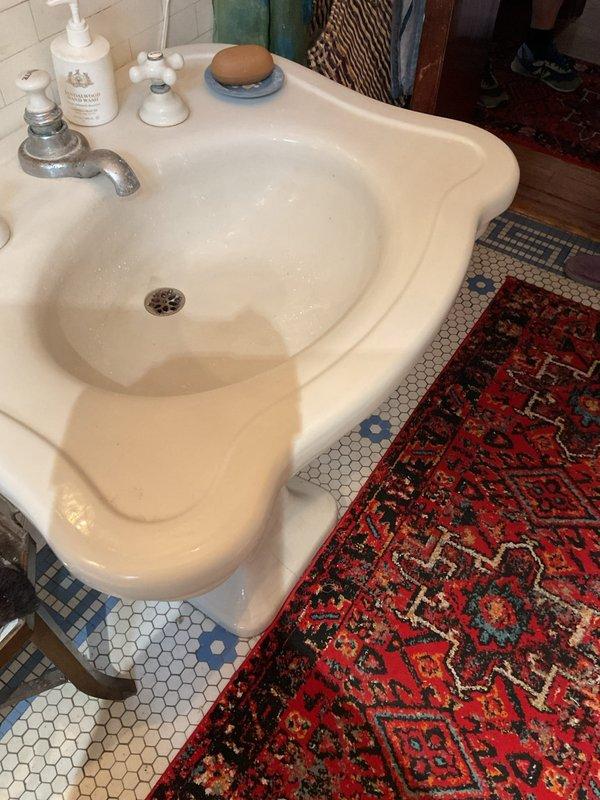 Responded to multiple slow-draining fixtures including three bathrooms, a basement utility sink, and toilet experiencing backup issues with black water surfacing in the bathtub. Performed rodding service on all affected drains to clear blockages and restore proper drainage throughout the plumbing system.