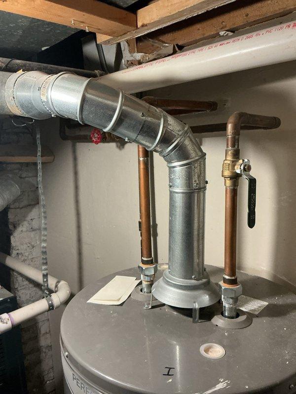 Responded to service call for 12-year-old 50-gallon water heater experiencing inadequate heating performance. Conducted comprehensive assessment of existing water heater installation, including inspection of galvanized venting system, copper supply lines, shut-off valves, and temperature-pressure relief valve configuration. Evaluated current system's heating capacity, recovery rate, and overall condition to determine replacement necessity. Documented existing plumbing connections, gas or electric service requirements, and venting configuration for proper replacement specifications. Provided detailed estimate for complete water heater replacement with new unit, including removal and disposal of old equipment, installation of new water heater with code-compliant connections, and verification of proper venting and safety controls. Additionally prepared estimate for preventative maintenance service on secondary water heater unit as requested.