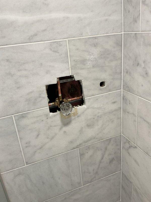 Responded to service call for water temperature control issue in shower. Upon inspection, identified faulty shower valve and compromised shower kit requiring replacement. Existing valve mechanism showed signs of wear affecting temperature regulation. Recommended complete shower valve and trim kit replacement to restore proper hot/cold water mixing and temperature control functionality.