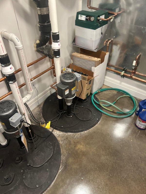 Provided estimate for dual sump pump system with automatic water shutoff capability and battery backup protection. Assessed existing mechanical room configuration with two pump assemblies, PVC discharge piping, and electrical controls to recommend enhanced system reliability during power outages.