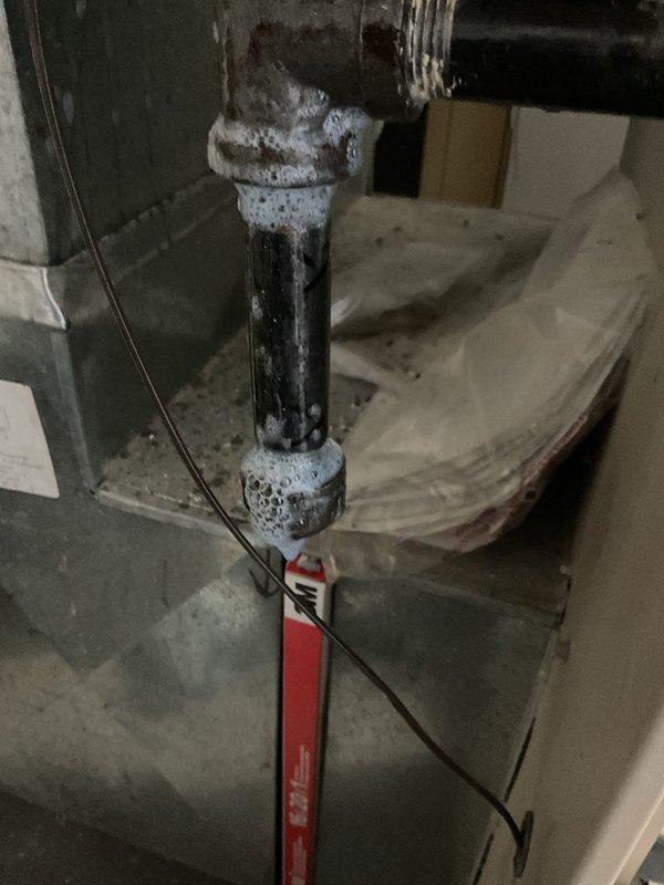 Responded to emergency gas leak on supply line serving furnace. Upon arrival, found active gas leak at corroded pipe coupling with gas supply still energized, creating immediate safety hazard. Shut off gas at main valve, verified leak location at deteriorated black iron pipe joint near water heater, and performed pressure test to confirm system integrity after repairs. Replaced failed coupling section, applied appropriate pipe dope and thread sealant, and restored gas service. Conducted final leak detection test using approved methods to ensure all connections were secure before returning system to operation.