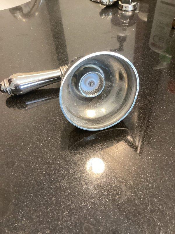 Completed installation of new handheld showerhead assembly with chrome finish. Verified all plumbing connections including flexible braided stainless steel supply lines, angle stop valve, and toilet tank connections were secure and functioning properly with no leaks detected.