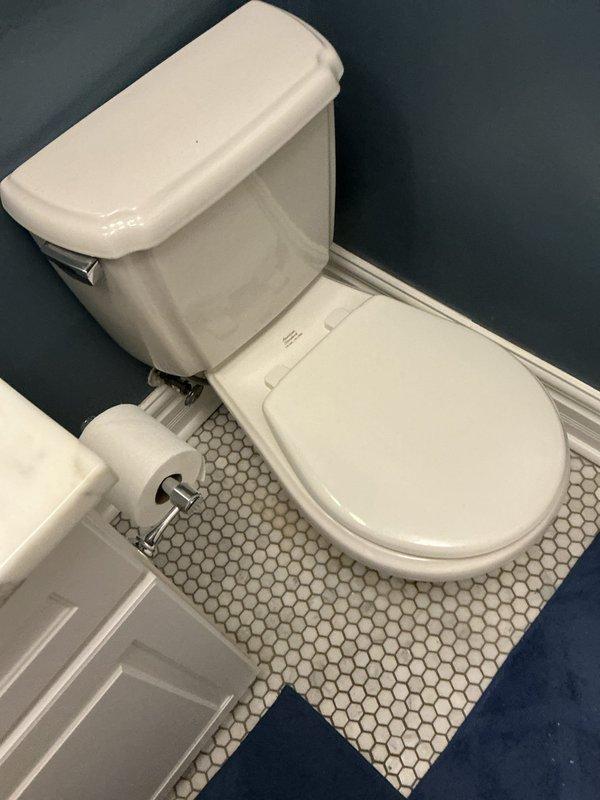 Responded to morning appointment request for toilet wax ring replacement. Upon arrival, removed and reset toilet on hexagonal tile floor, replacing deteriorated wax ring seal to eliminate leaking at base. Reinstalled toilet securely and tested for proper function and seal integrity.