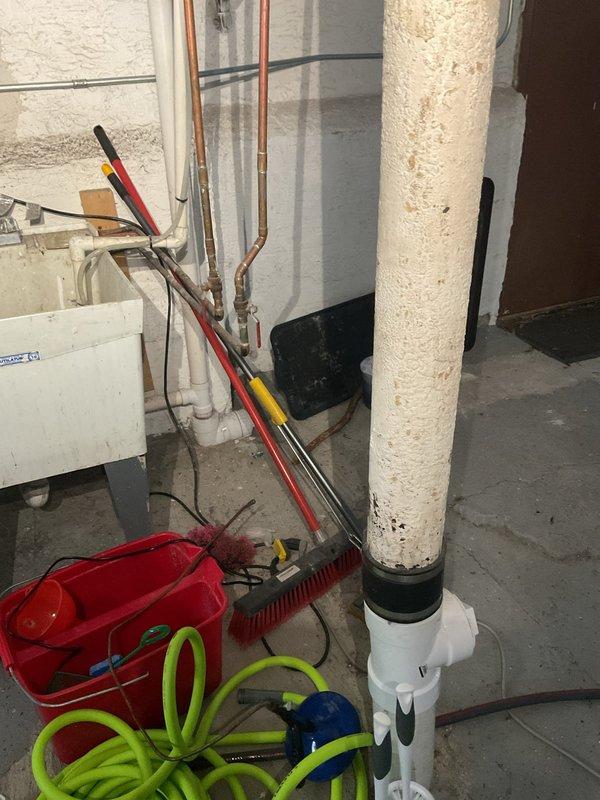 Responded to wastewater backup issue where kitchen sink drainage was flowing into shower drain in century-old residence. Performed main drain cleanout to clear blockage in shared waste line causing cross-contamination between fixtures. Successfully restored proper drainage flow, eliminating backup condition and ensuring independent operation of kitchen and bathroom plumbing systems.