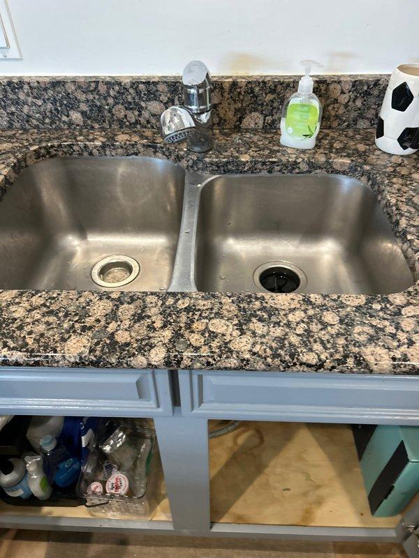 Responded to service call for non-operational garbage disposal unit in residential kitchen. Upon arrival, assessed double-basin stainless steel sink installation and verified disposal malfunction. Performed diagnostic testing, identified issue, and successfully restored garbage disposal to proper working condition, ensuring unit operates safely and efficiently.