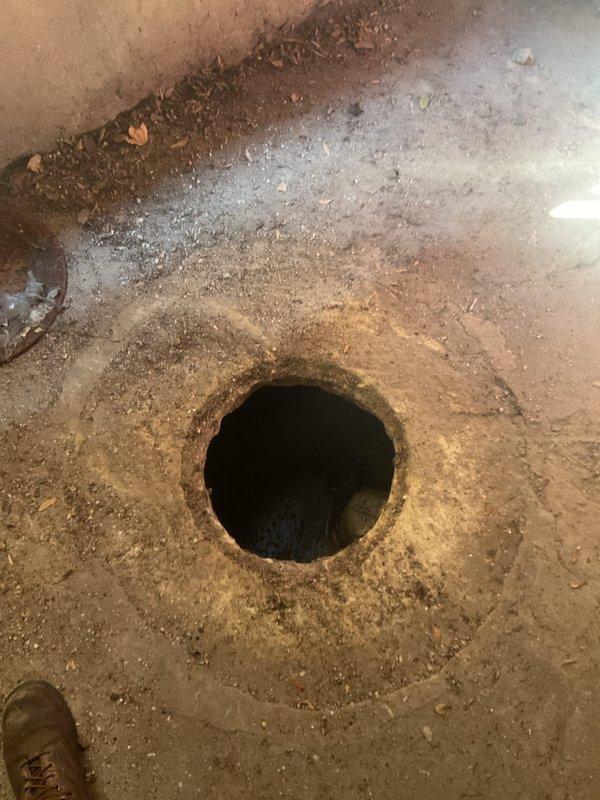 Performed catch basin inspection and cleaning service at a 9-unit condominium building. Upon arrival, located the catch basin access point in the basement/utility area and removed the circular metal drain cover to assess the condition of the basin. The basin showed signs of accumulated sediment, debris, and organic material buildup. Thoroughly cleaned and flushed the catch basin to restore proper drainage function, removing all blockages and ensuring unobstructed water flow through the system. Reinstalled the drain cover and verified proper operation of the drainage system.