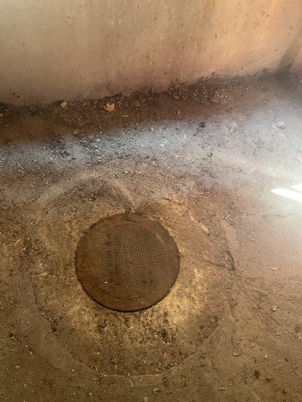 Performed catch basin inspection and cleaning service at a 9-unit condominium building. Upon arrival, located the catch basin access point in the basement/utility area and removed the circular metal drain cover to assess the condition of the basin. The basin showed signs of accumulated sediment, debris, and organic material buildup. Thoroughly cleaned and flushed the catch basin to restore proper drainage function, removing all blockages and ensuring unobstructed water flow through the system. Reinstalled the drain cover and verified proper operation of the drainage system.