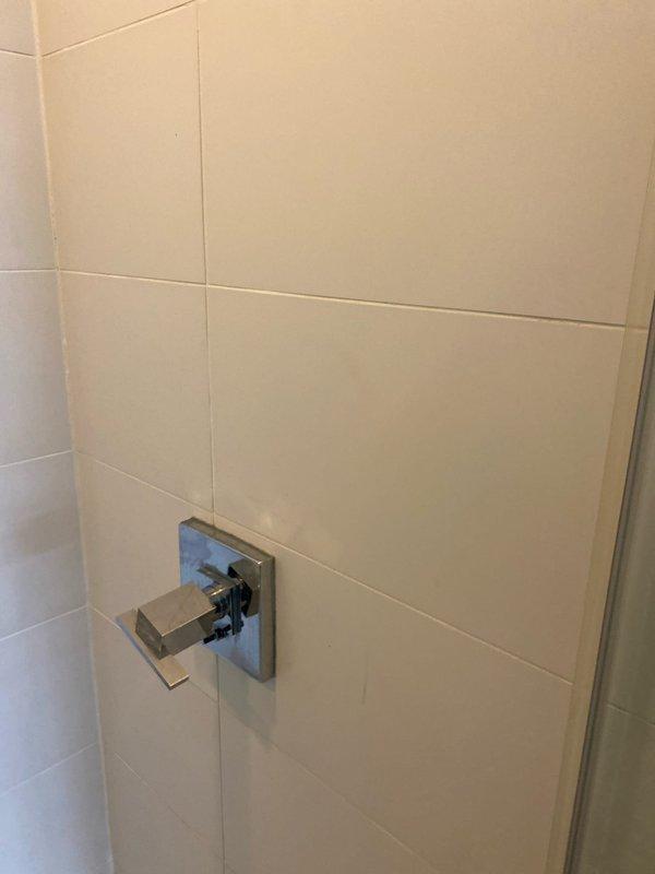 Responded to customer complaint of noise in pipes when flushing toilet, which began after recent shower valve replacement. Inspected toilet tank and identified improperly adjusted fill valve causing water hammer in supply lines. Adjusted fill valve flow rate and verified flush mechanism operation. Tested system multiple times to confirm elimination of pipe noise and proper refill cycle.