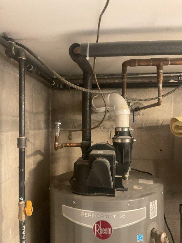 Conducted follow-up site visit to assess existing Rheem Performance water heater installation and evaluate property for water filtration system installation. Documented current water heater setup including all copper piping connections, PVC discharge lines, electrical conduit, and temperature control components to prepare comprehensive estimates for potential water heater replacement and whole-house water filtration system integration with existing plumbing infrastructure.