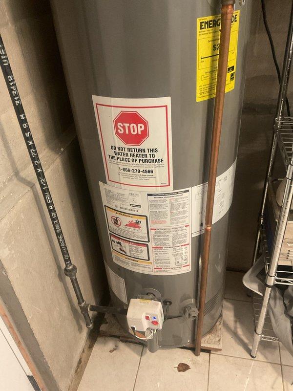 Conducted follow-up site visit to assess existing Rheem Performance water heater installation and evaluate property for water filtration system installation. Documented current water heater setup including all copper piping connections, PVC discharge lines, electrical conduit, and temperature control components to prepare comprehensive estimates for potential water heater replacement and whole-house water filtration system integration with existing plumbing infrastructure.