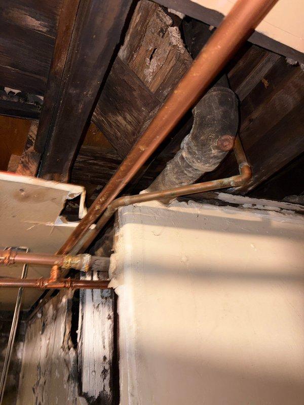 Responded to water leak originating from bathroom plumbing serving sink and tub fixtures. Inspected basement crawlspace area and identified leak source in copper supply lines running beneath bathroom. Repaired compromised pipe section, verified all connections and fittings were secure, and tested system under pressure to confirm leak was eliminated and proper water flow was restored to vessel sink and tub.