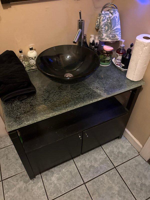 Responded to water leak originating from bathroom plumbing serving sink and tub fixtures. Inspected basement crawlspace area and identified leak source in copper supply lines running beneath bathroom. Repaired compromised pipe section, verified all connections and fittings were secure, and tested system under pressure to confirm leak was eliminated and proper water flow was restored to vessel sink and tub.