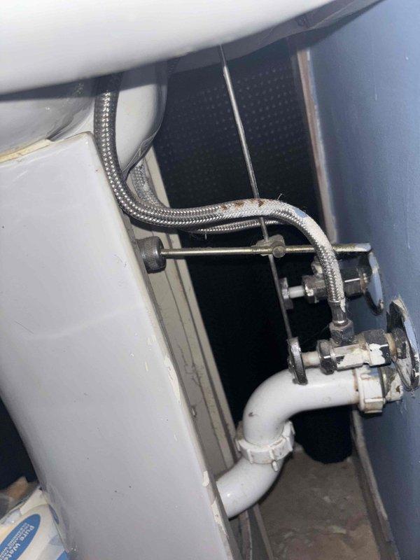 Responded to morning appointment for dishwasher continuously filling with water despite water supply being shut off. Diagnosed faulty inlet valve allowing water to bypass shutoff position. Replaced defective dishwasher inlet valve assembly to resolve unauthorized water flow issue. Additionally, replaced worn pop-up drain stopper assembly in pedestal sink as requested. Inspected under-sink plumbing during service call and noted significant corrosion on brass trap fitting, which was documented with photographs for future maintenance consideration. All work completed and tested for proper operation before departure.
