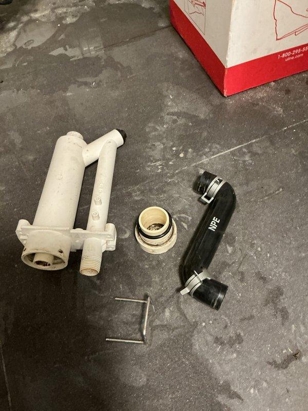 Removed and hauled away the failed condensate trap assembly from the domestic Navien tankless water heater. Installed a new factory-supplied condensate trap assembly to restore proper drainage and prevent potential water damage. System tested and verified operational upon completion.
