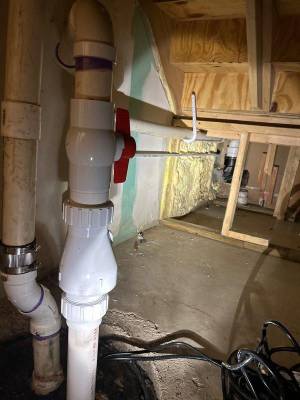 Responded to emergency service call for ejector pump running continuously since morning. Upon arrival, inspected the ejector pump system in basement utility area and identified mechanical failure preventing proper cycle operation. Evaluated existing plumbing configuration including black iron pipe fittings, PVC discharge piping, and pump assembly connections. Documented condition of pump system components, check valve operation, and electrical connections. Provided detailed estimate for ejector pump replacement including removal of failed unit, installation of new pump with appropriate check valve and discharge piping modifications, and testing of complete system to ensure proper float switch operation and automatic cycling functionality.