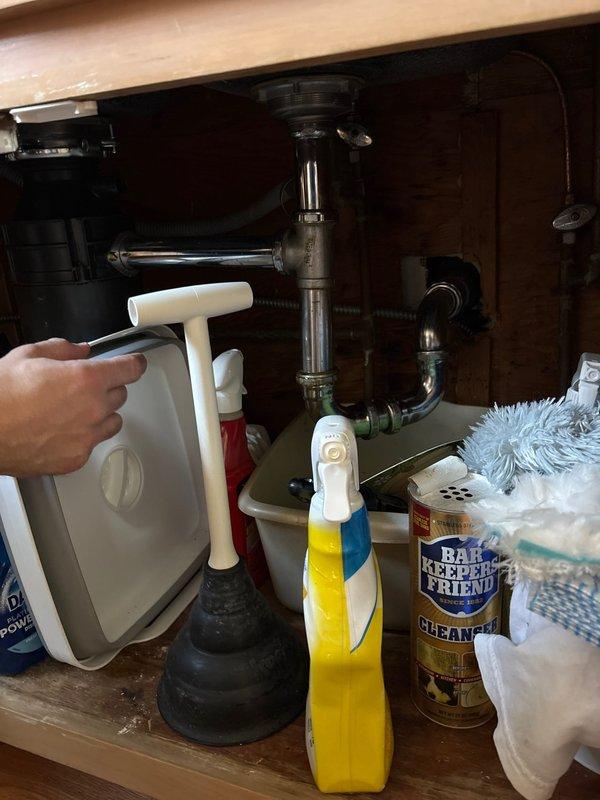 Responded to service call for multiple plumbing concerns including kitchen sink drain, basement utility sink faucet, and upstairs bathroom toilet requiring internal mechanism and wax ring evaluation. Inspected kitchen sink drainage system and verified P-trap and drain line connections beneath cabinet. Assessed upstairs bathroom toilet for proper operation, wax ring seal integrity, and internal tank components to determine necessary repairs or replacements.