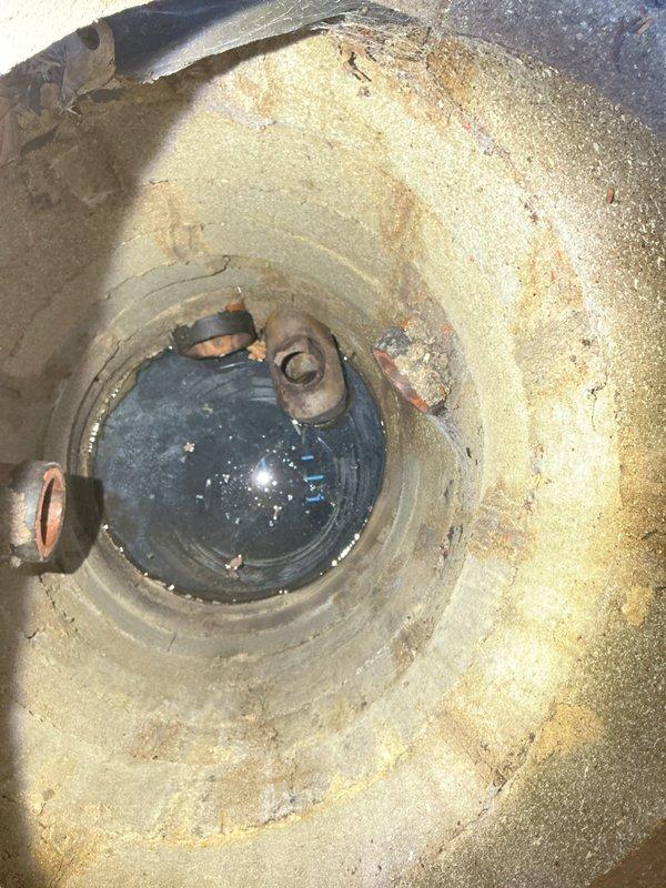 Responded to morning appointment for reported broken sewer line at residential property. Upon arrival, conducted thorough inspection of the plumbing system including interior access points. Documentation revealed water heater showing significant age-related deterioration with rust staining, mineral deposits, and corrosion throughout the tank interior and around heating element assembly. Inspection also identified floor-level sewer access point in utility area near kitchen or laundry room location. Photographed all relevant findings to provide comprehensive visual documentation for estimate preparation. Provided detailed assessment of sewer line condition and recommended repair options to address the broken line issue.
